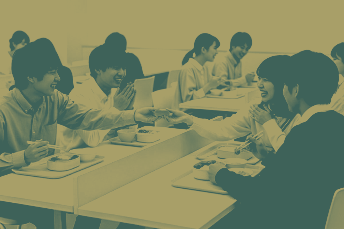 Senior leaders in discussion during a leadership development session in a Singapore office